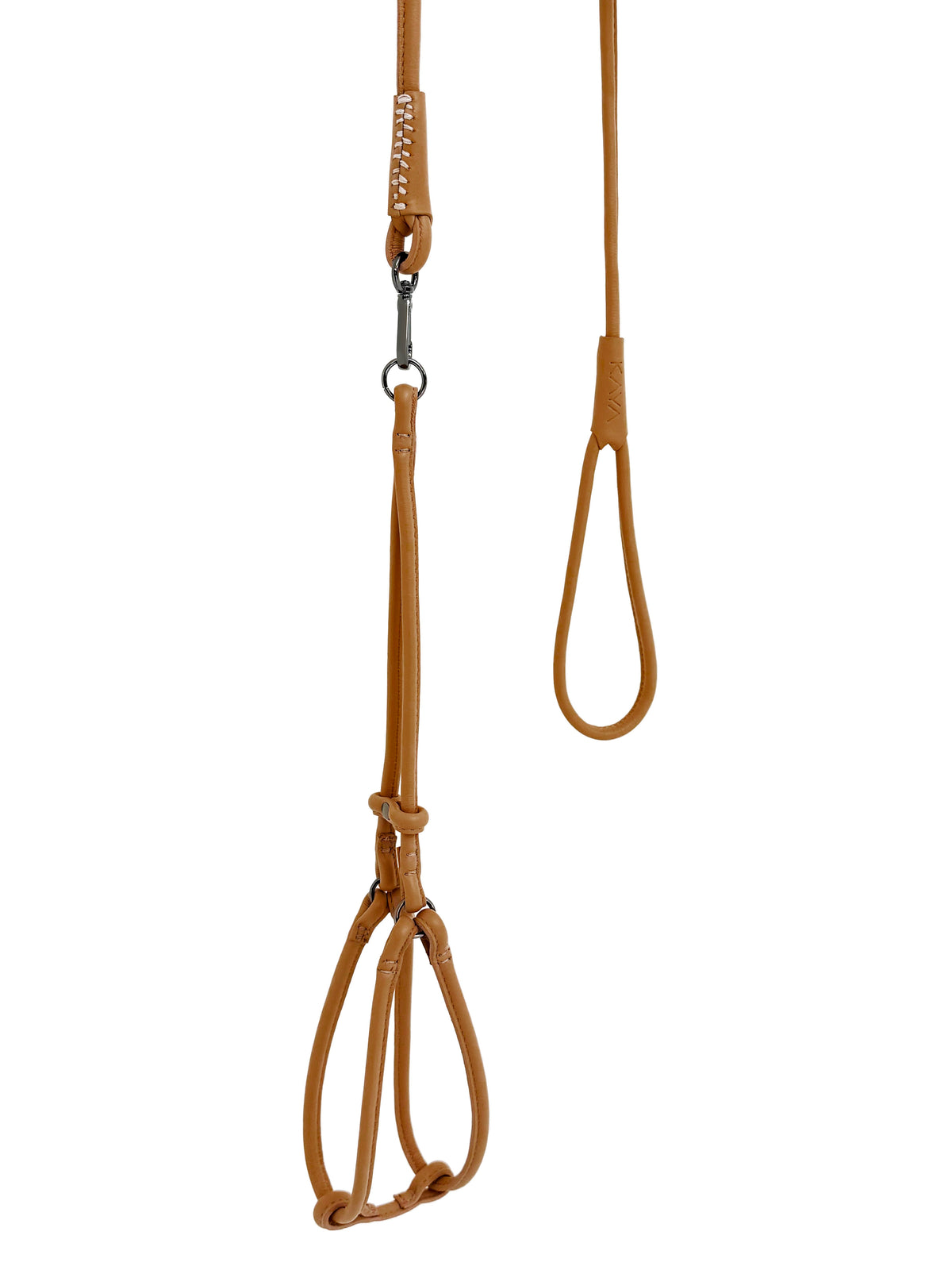 Brown leather dog harness with a metal clip on a white background